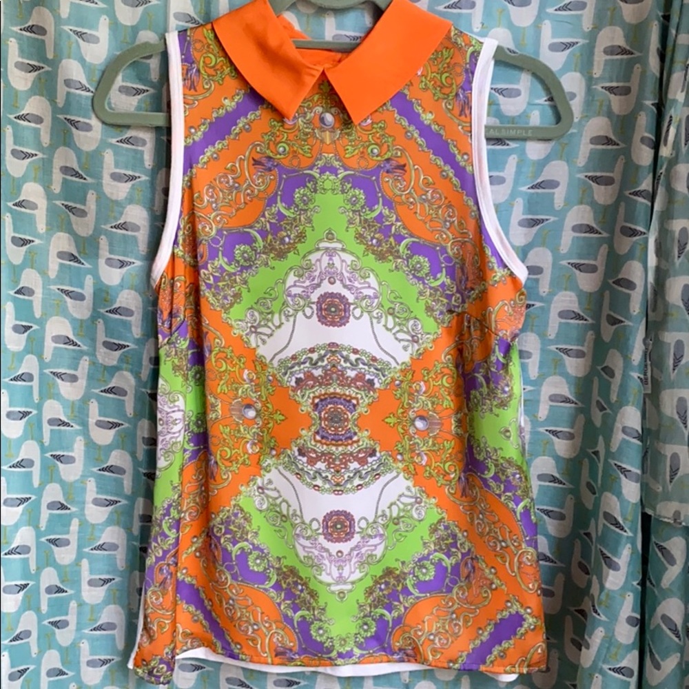Allen B. Sleeveless top with collar.